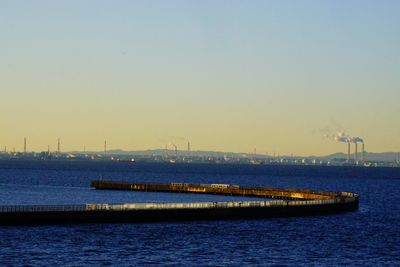 Scenic view of sea against clear sky during sunset