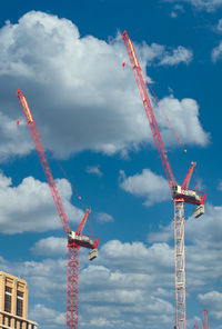 Low angle view of crane against sky