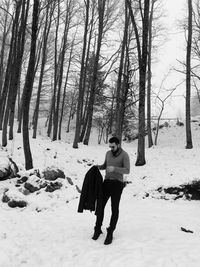 Full length of man on snow covered field