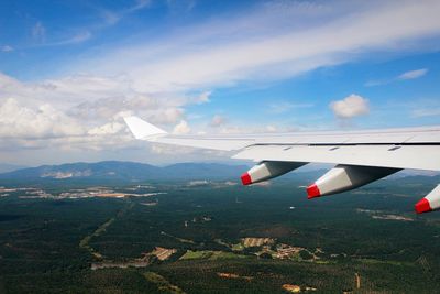 Airplane flying over landscape