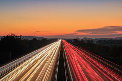 High angle view of light trails on highway at night