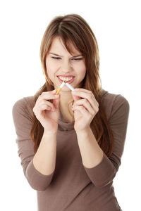Portrait of a beautiful young woman over white background