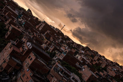 Low angle view of buildings in town against sky