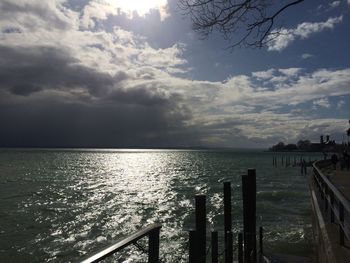 Scenic view of sea against cloudy sky