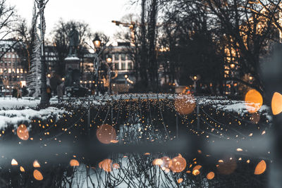 Illuminated city during winter at dusk