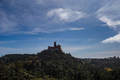 View of temple against cloudy sky