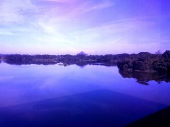 Reflection of trees in calm lake