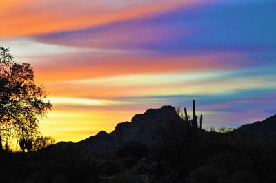 Low angle view of dramatic sky during sunset