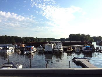 Boats moored at harbor