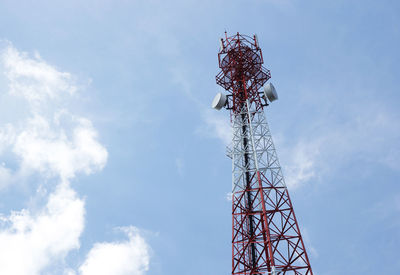 Low angle view of communications tower against sky