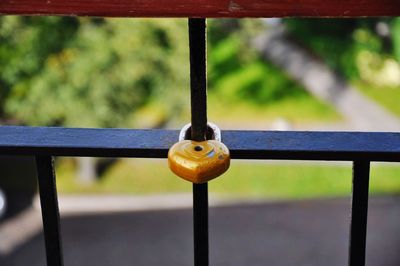 Close-up of love lock on railing