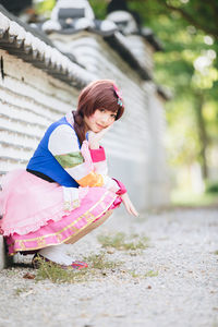 Cute girl with pink umbrella