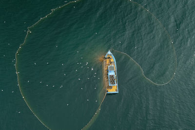 High angle view of ship sailing in sea