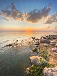 Scenic view of sea against sky during sunset