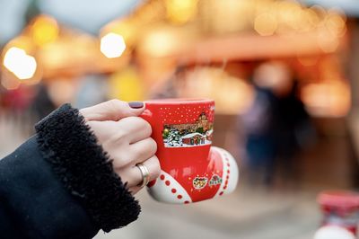 Close-up of hand holding ice cream cone