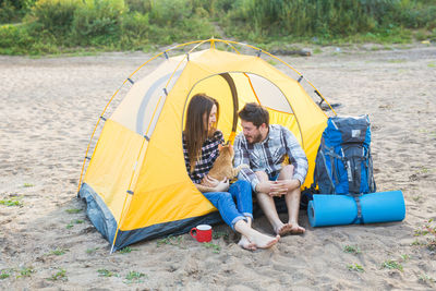 People sitting on tent