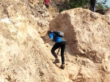 Full length of man standing on rock