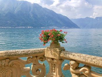 Scenic view of sea and mountains against sky