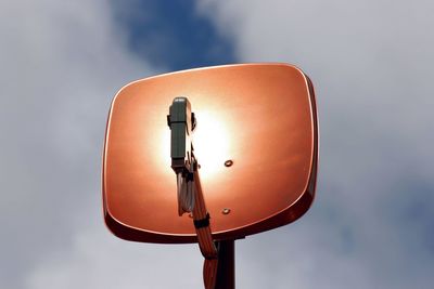 Low angle view of street light against sky