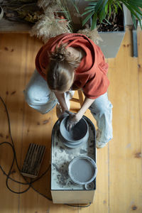 High angle view of man working on table