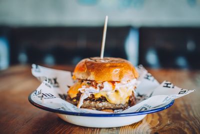 Close-up of hamburger served on table