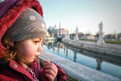 Portrait of girl looking at water