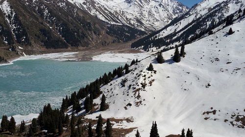 Scenic view of snowcapped mountains during winter