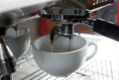 Close-up of coffee cup on table in cafe