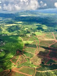 Aerial view of agricultural field against sky