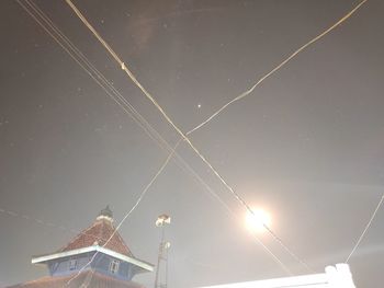 Low angle view of illuminated building against sky