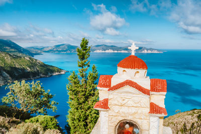 High angle view of church against sea and sky
