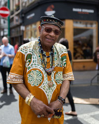Portrait of man wearing sunglasses standing outdoors