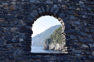 View of arched wall through rocks