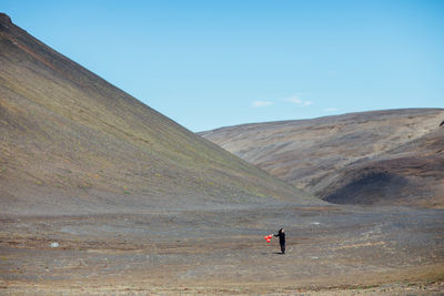 Wide angle of a woman on landscape