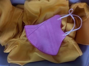 High angle view of purple tied up on paper