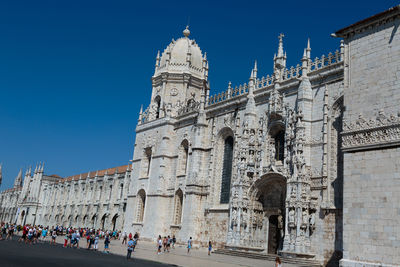 Group of people in front of historical building