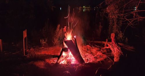 Panoramic view of fire at night