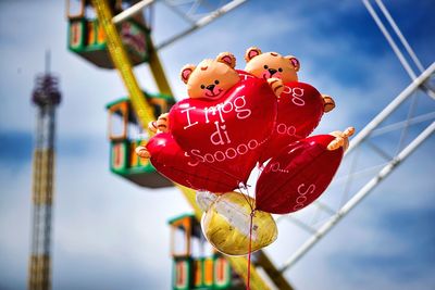 Low angle view of inflatable balloons at amusement park