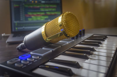 Home music studio microphone, midi keyboard, laptop