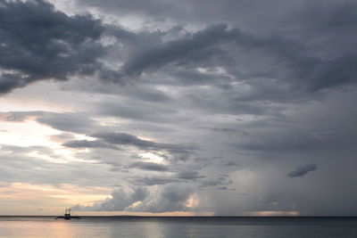 Scenic view of sea against dramatic sky