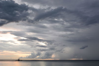 Scenic view of sea against dramatic sky