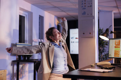 Businesswoman using mobile phone in office