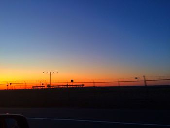 Silhouette of road at sunset