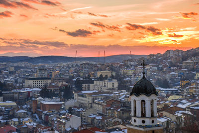 High angle view of city at sunset