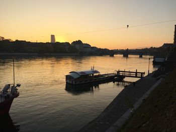 Scenic view of river against sky during sunset