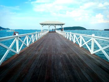 Pier over sea against sky