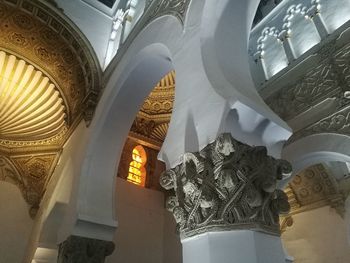 Low angle view of ornate ceiling in temple