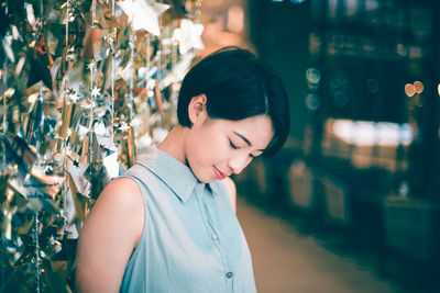 Young woman looking away outdoors