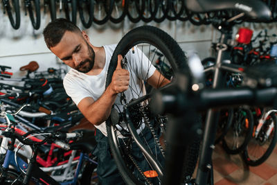Low section of man riding bicycle