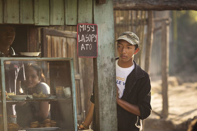 Young man standing in a market